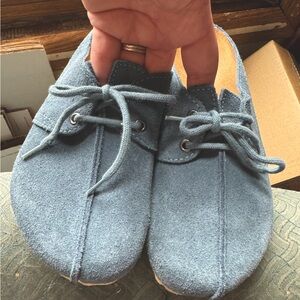 Birkenstock blue suede clogs.
